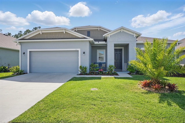 626 Ocean Jasper Dr, Saint Augustine, FL 32086 - view of front of property featuring a front lawn, a garage, driveway, and stucco siding