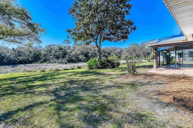 view of yard featuring a sunroom