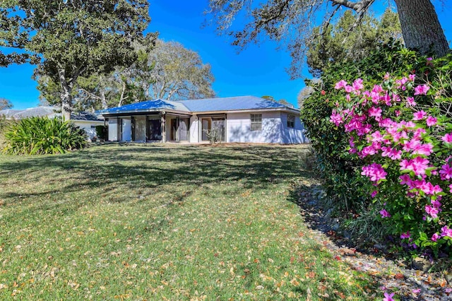 view of front of home with a front yard