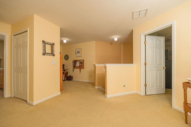5351 Cypress Links Blvd, Elkton, FL 32033 - hall featuring baseboards, visible vents, and light colored carpet