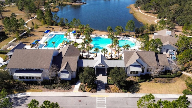 birds eye view of property with a water view