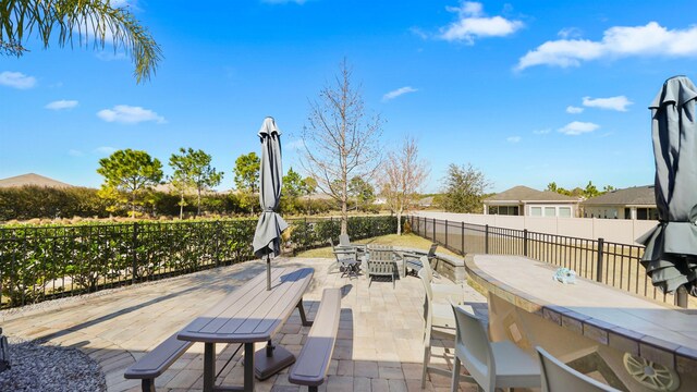 view of patio / terrace with outdoor dining area and a fenced backyard