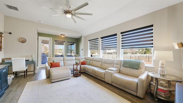 living area featuring plenty of natural light, wood finished floors, and visible vents