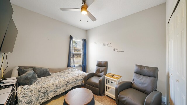 bedroom with a ceiling fan and a closet