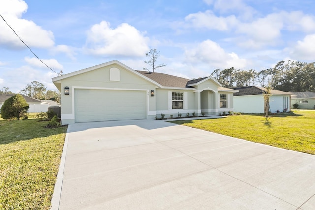 single story home with stucco siding, an attached garage, concrete driveway, and a front yard