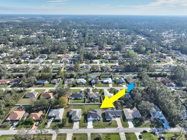 birds eye view of property with a residential view