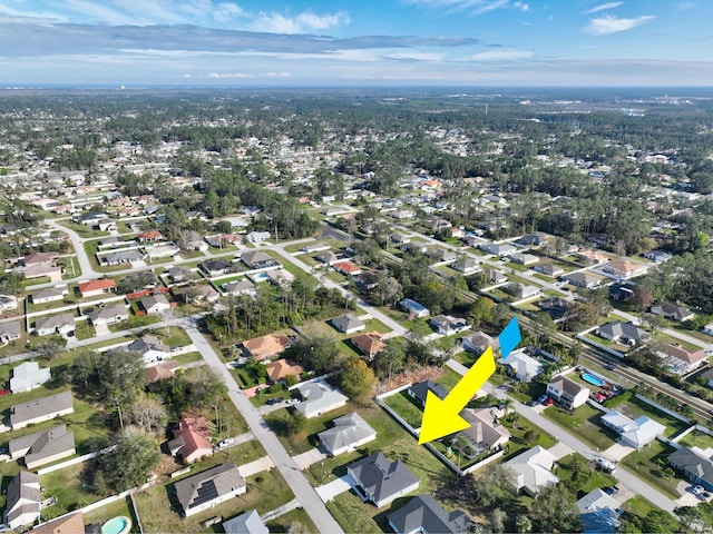 birds eye view of property with a residential view