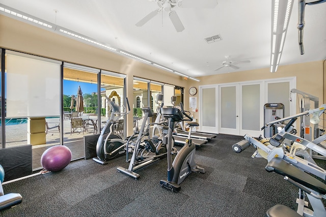 exercise room featuring ceiling fan, visible vents, and french doors