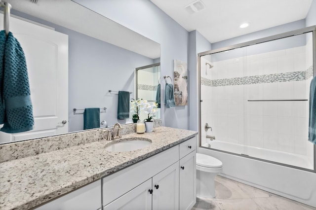 full bathroom with enclosed tub / shower combo, toilet, visible vents, and vanity