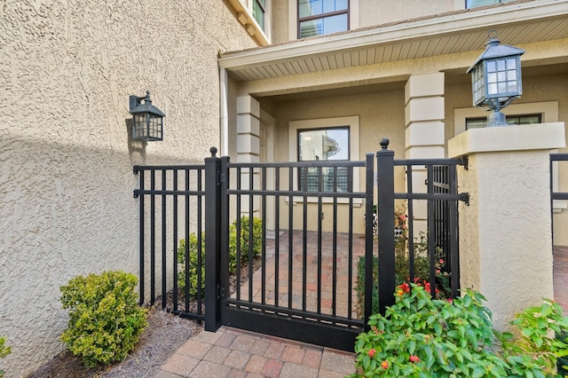 view of gate with fence