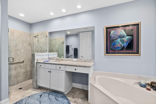 full bath featuring tiled shower, a garden tub, vanity, and recessed lighting