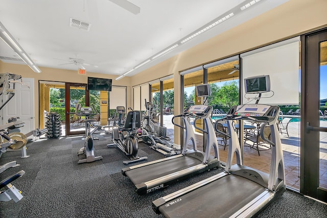 gym featuring a ceiling fan and visible vents