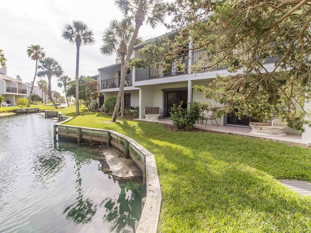890 A1A Beach Blvd Unit 74, Saint Augustine Beach, FL 32080 - view of community featuring a patio area, a water view, and a lawn