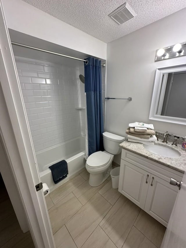890 A1A Beach Blvd Unit 74, Saint Augustine Beach, FL 32080 - bathroom with vanity, shower / bath combo, a textured ceiling, and tile patterned flooring