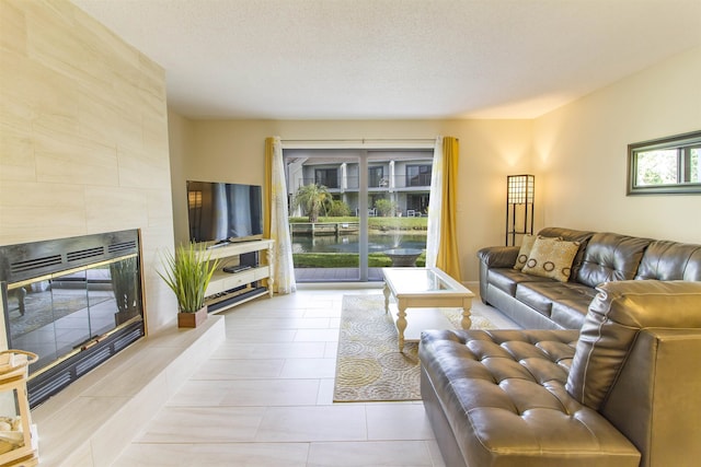 890 A1A Beach Blvd Unit 74, Saint Augustine Beach, FL 32080 - living area with a tile fireplace and light tile patterned floors