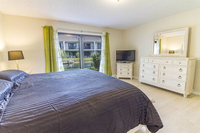 890 A1A Beach Blvd Unit 74, Saint Augustine Beach, FL 32080 - bedroom featuring baseboards and access to exterior