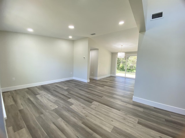 spare room featuring dark wood-type flooring