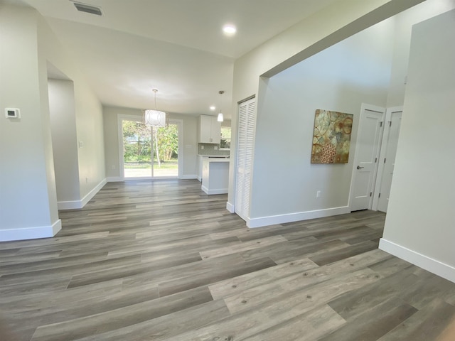 unfurnished living room with hardwood / wood-style flooring