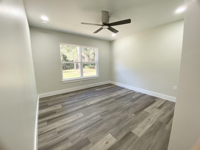 unfurnished room featuring ceiling fan and wood-type flooring