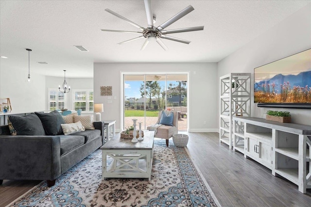 295 Ferndale Way, Saint Augustine, FL 32092 - living room with wood finished floors, a ceiling fan, plenty of natural light, a chandelier, and a textured ceiling
