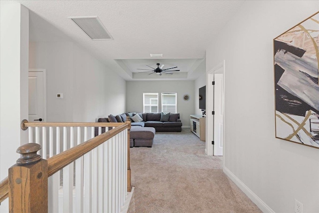 295 Ferndale Way, Saint Augustine, FL 32092 - hall featuring light carpet, a tray ceiling, baseboards, and an upstairs landing