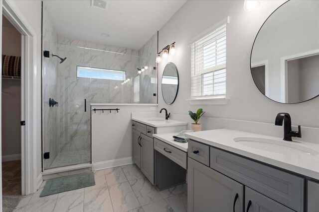 295 Ferndale Way, Saint Augustine, FL 32092 - bathroom with a marble finish shower, marble finish flooring, two vanities, and baseboards