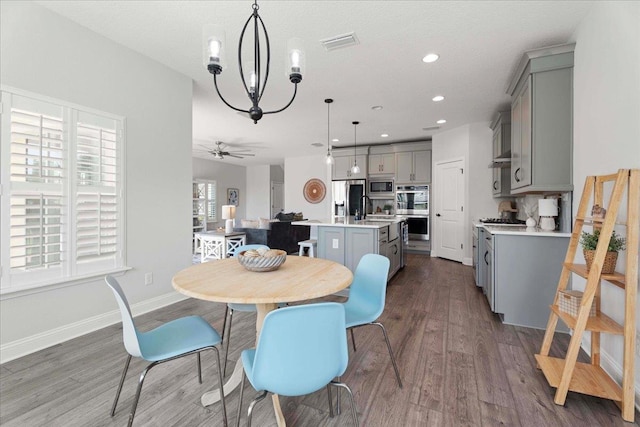 295 Ferndale Way, Saint Augustine, FL 32092 - dining room featuring wood finished floors, recessed lighting, baseboards, a chandelier, and ceiling fan