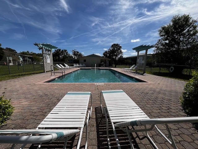 view of pool featuring a patio