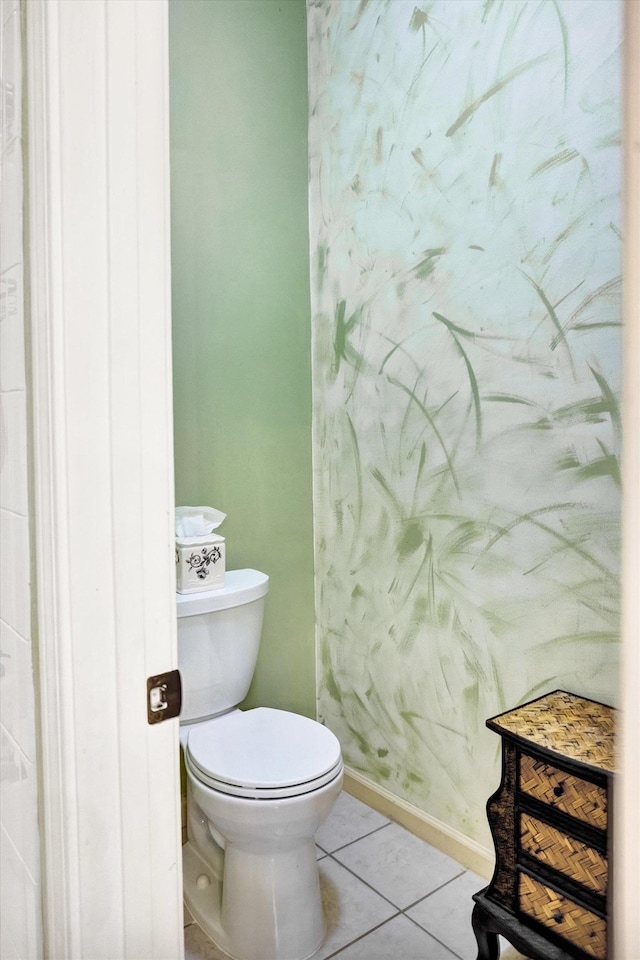 bathroom with tile patterned flooring and toilet