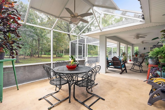 sunroom / solarium featuring ceiling fan and lofted ceiling