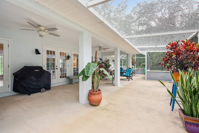 view of patio / terrace with a lanai, a grill, ceiling fan, and french doors