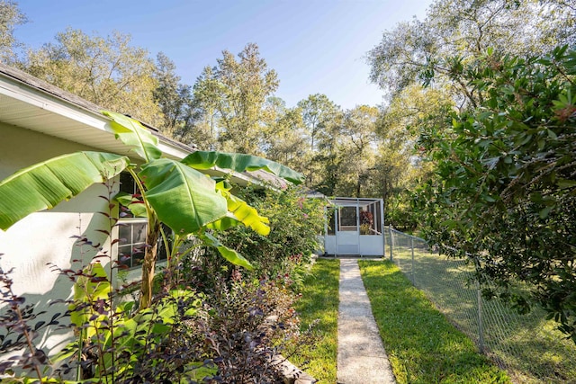 view of yard with a lanai