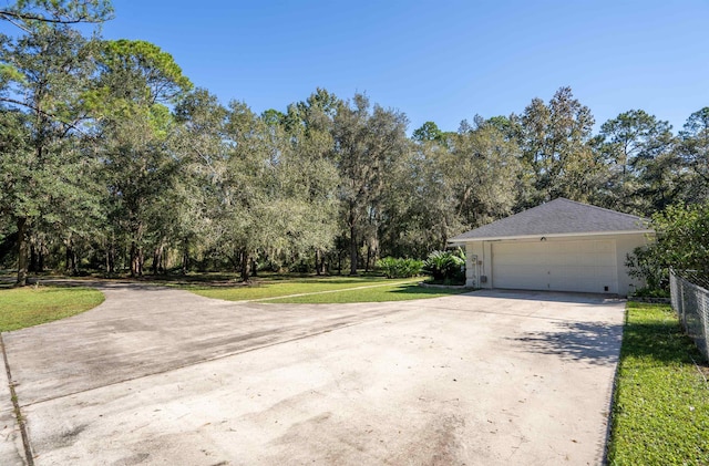 garage featuring a lawn