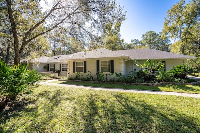 ranch-style home with a front yard