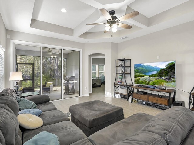 55 Concave Ln, Saint Augustine, FL 32095 - living area with ceiling fan, coffered ceiling, arched walkways, light wood finished floors, and healthy amount of natural light
