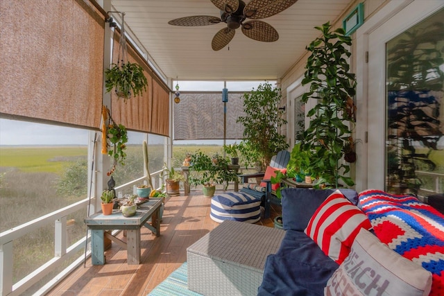 sunroom with ceiling fan and wooden ceiling