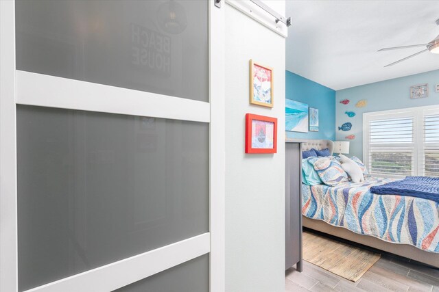 bedroom featuring ceiling fan and light wood-type flooring