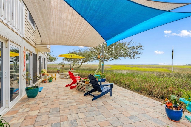 view of patio with a rural view