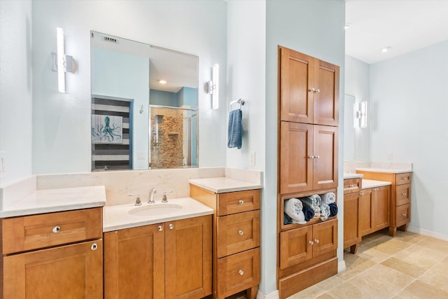 bathroom featuring vanity and an enclosed shower