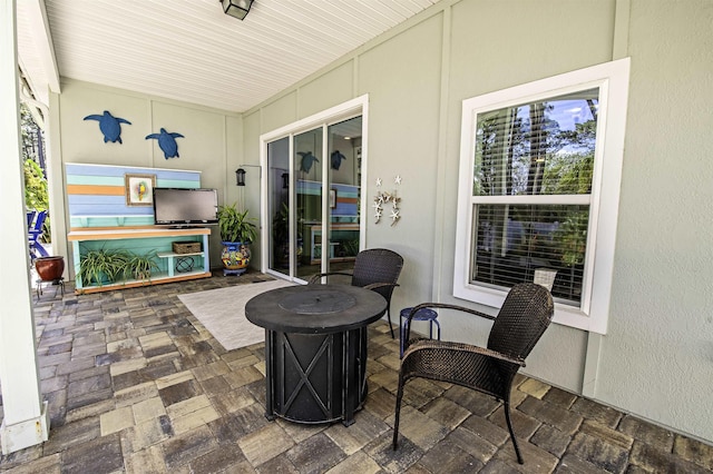 view of patio featuring an outdoor fire pit