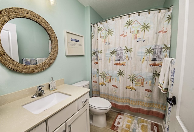 bathroom featuring hardwood / wood-style floors, vanity, curtained shower, and toilet