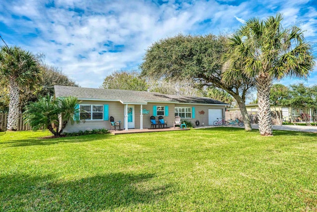 view of front of property featuring a garage and a front yard