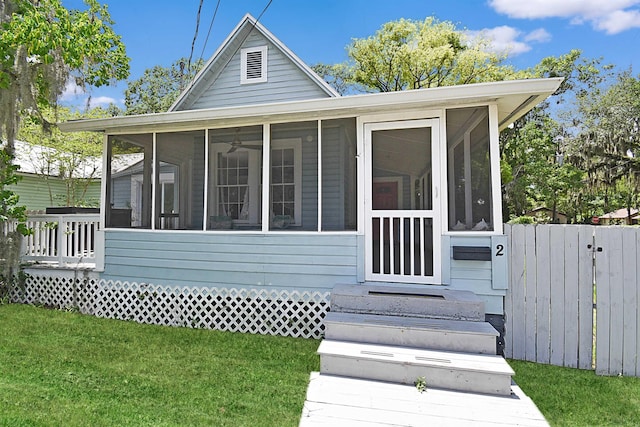 view of front of property with a sunroom