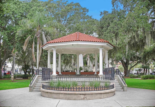 surrounding community with a gazebo and a lawn