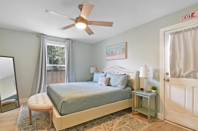 bedroom with wood finished floors and ceiling fan