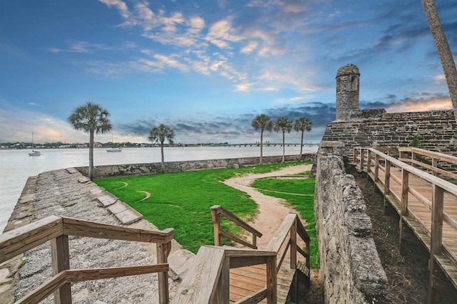 view of grassy yard with a water view