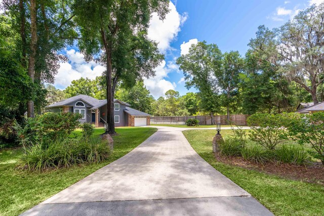 exterior space featuring a front yard and a garage