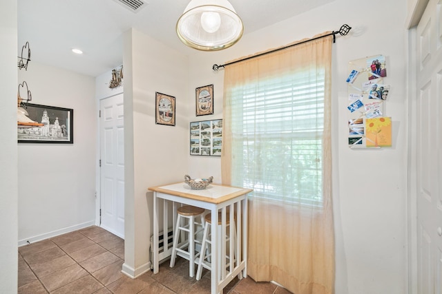 hallway featuring tile patterned floors