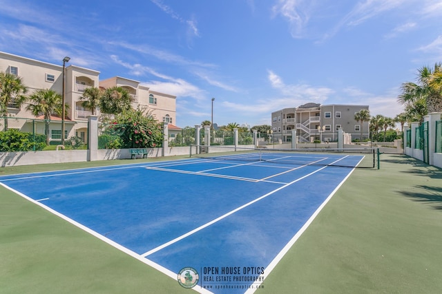 view of sport court with basketball hoop