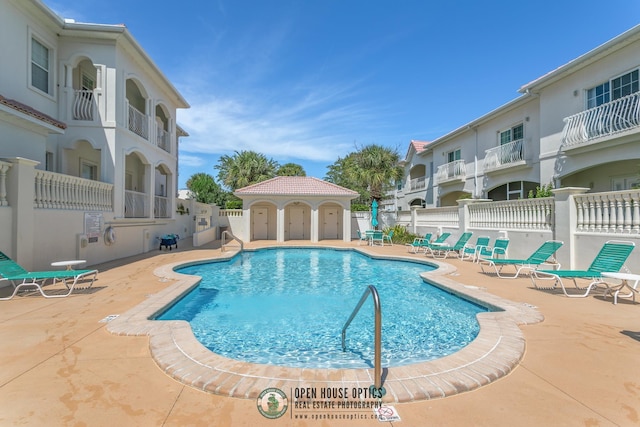 view of swimming pool with a patio area